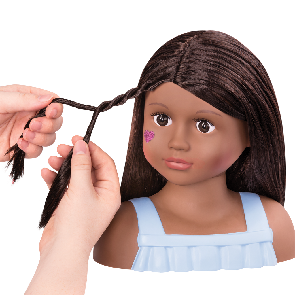 Brunette doll styling head with hair accessories