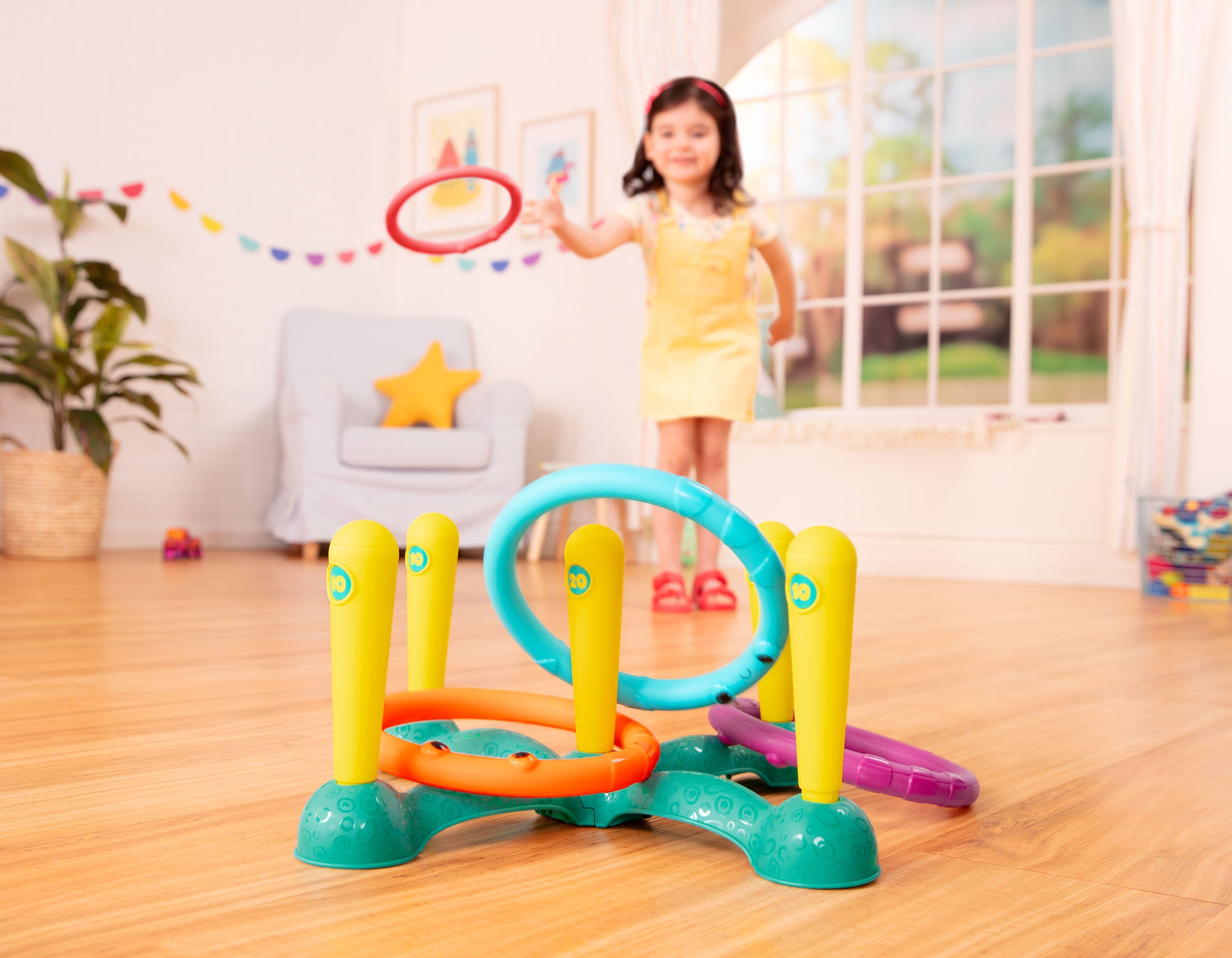 Ring toss game with five rings and five numbered pegs.