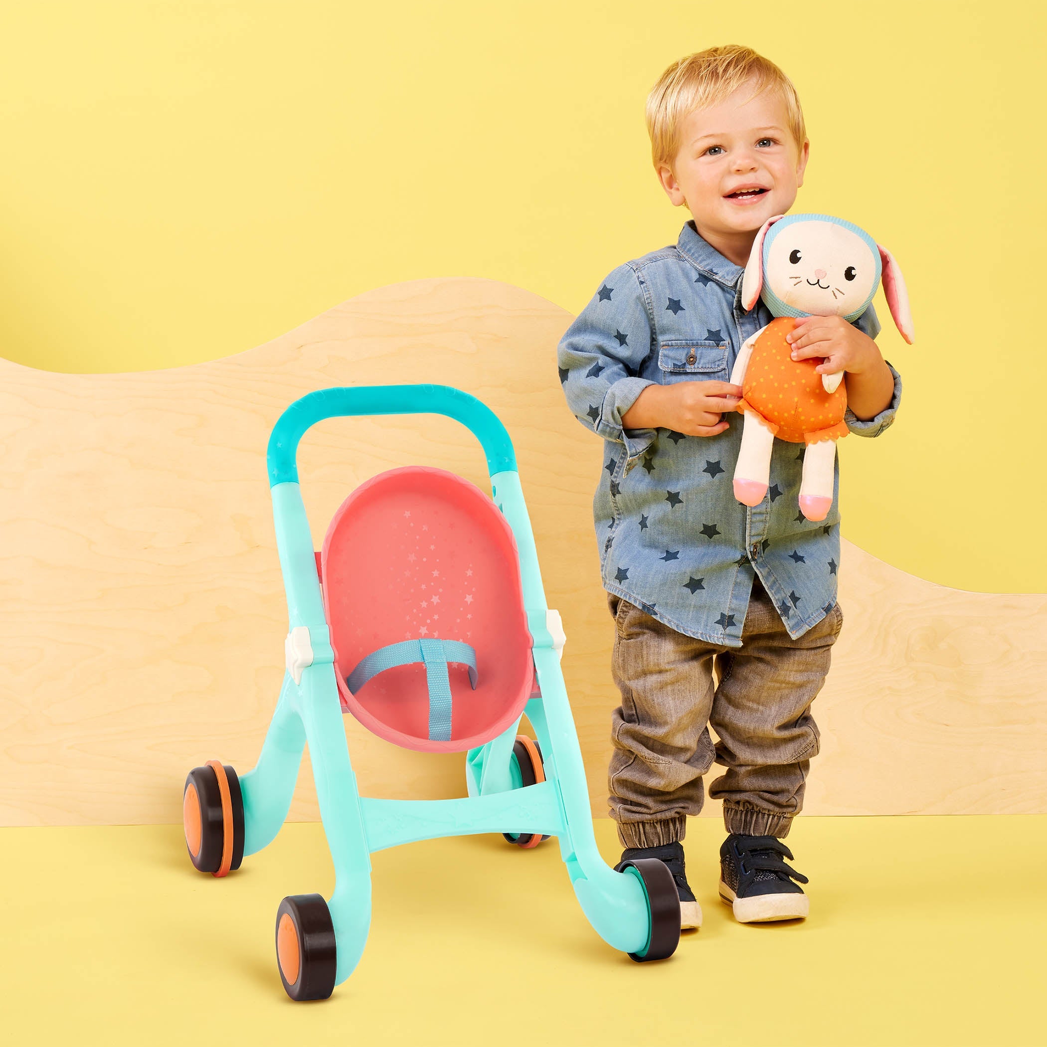 Toy stroller with plush bunny.