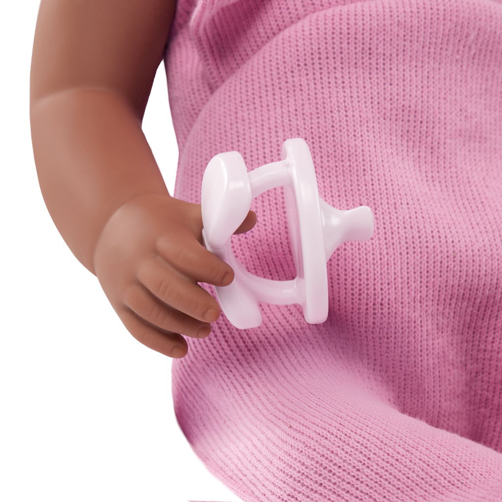 LullaBaby doll in purple romper